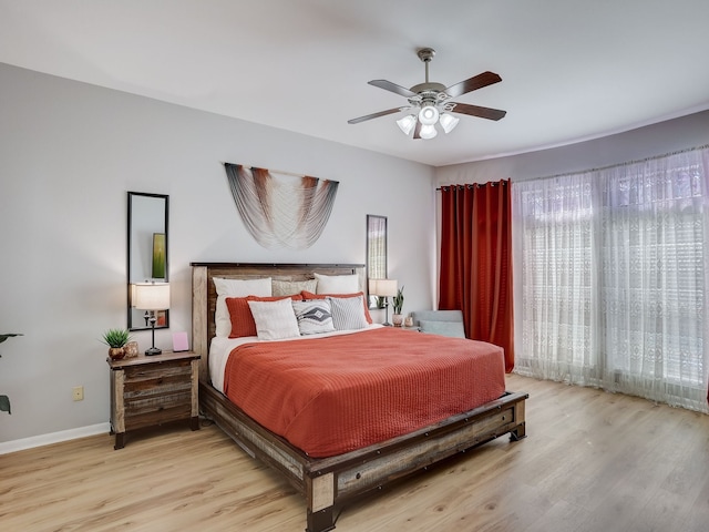 bedroom with ceiling fan and light hardwood / wood-style flooring