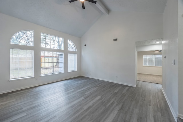 interior space with high vaulted ceiling, dark hardwood / wood-style flooring, ceiling fan, and beam ceiling