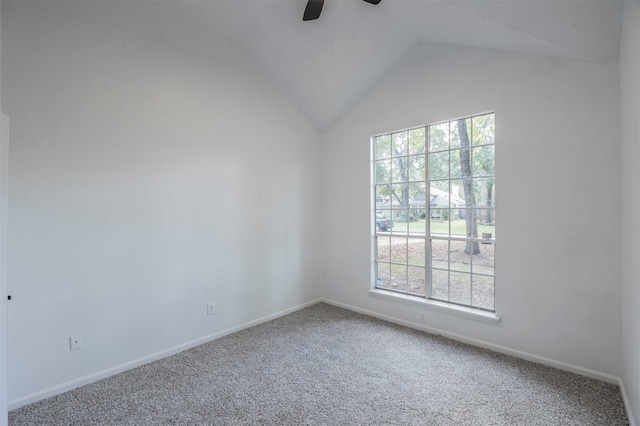 carpeted spare room with lofted ceiling and ceiling fan