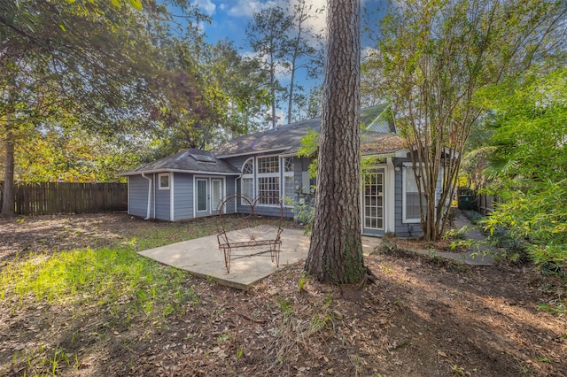 rear view of property with a patio area