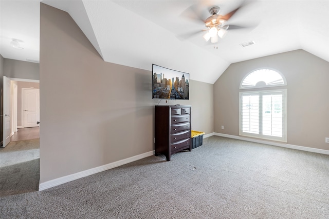 interior space with carpet, ceiling fan, and lofted ceiling