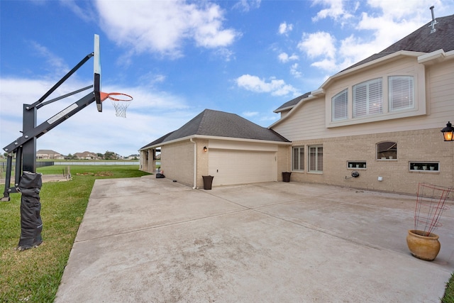 view of home's exterior featuring a yard and a garage