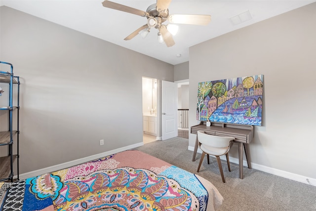 carpeted bedroom with connected bathroom and ceiling fan