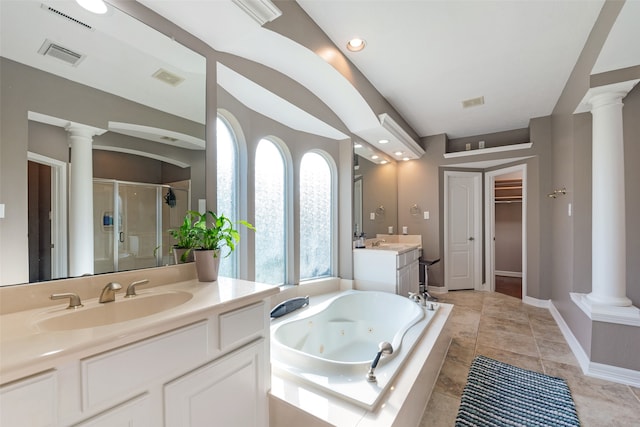 bathroom with tile patterned flooring, vanity, ornate columns, and shower with separate bathtub