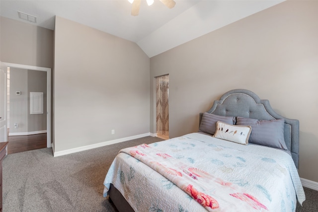 carpeted bedroom with ceiling fan and lofted ceiling