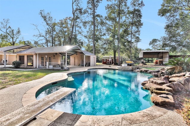 view of swimming pool with french doors and a patio