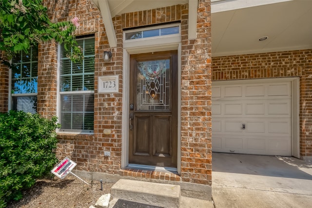 property entrance with a garage