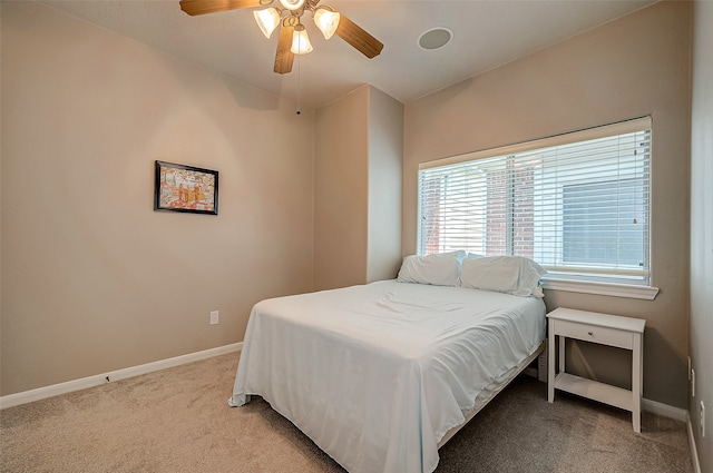 bedroom with light colored carpet and ceiling fan