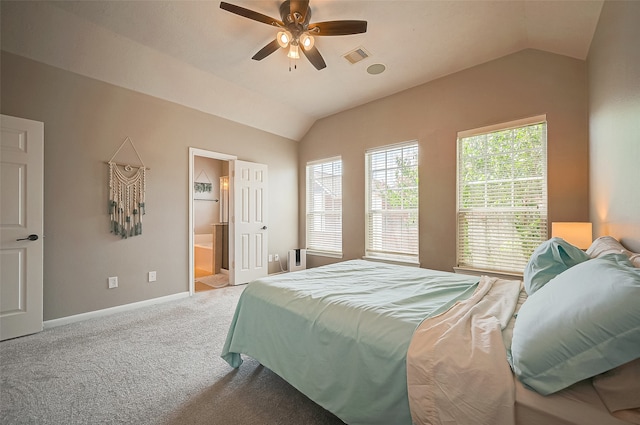 carpeted bedroom featuring ensuite bathroom, ceiling fan, and vaulted ceiling