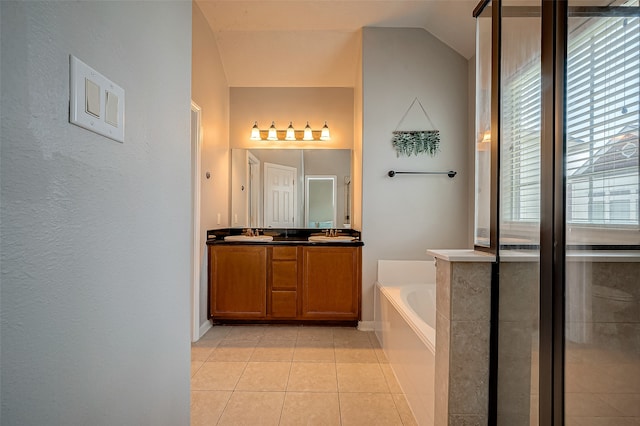 bathroom with vanity, independent shower and bath, lofted ceiling, and tile patterned floors