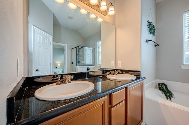 bathroom featuring vanity, plus walk in shower, and lofted ceiling