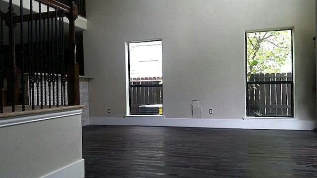 unfurnished room featuring dark hardwood / wood-style floors