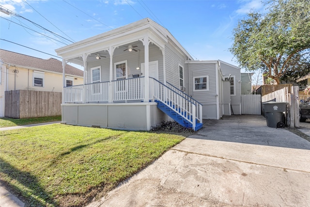 view of front of home with covered porch and a front yard