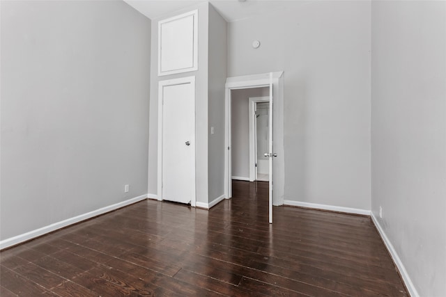 spare room with dark hardwood / wood-style floors