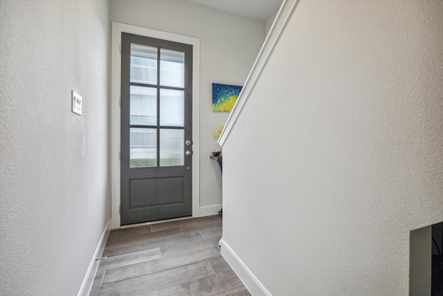 doorway to outside with light hardwood / wood-style floors