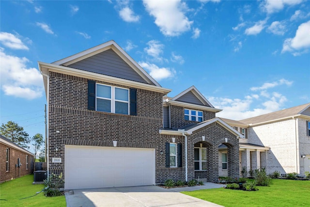 view of front of home with a front lawn, a garage, and central AC