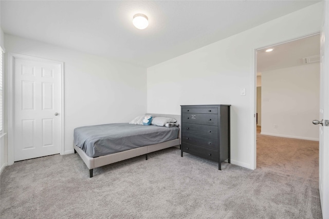 bedroom with light colored carpet