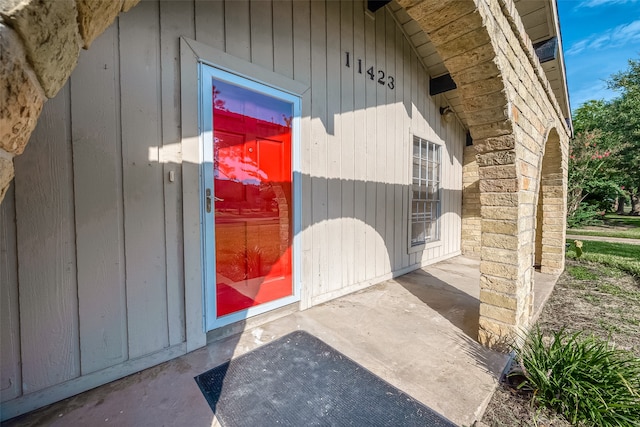 doorway to property with a patio