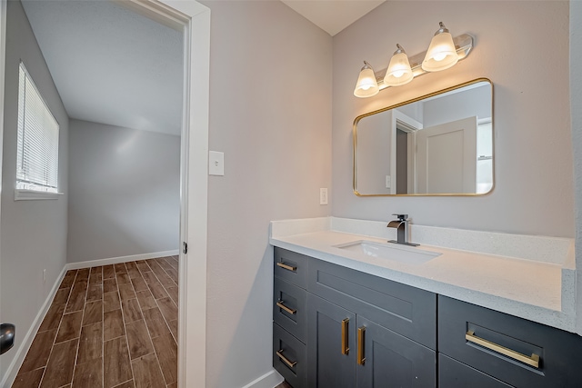 bathroom with vanity and hardwood / wood-style flooring