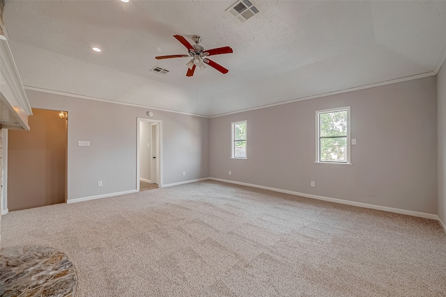 empty room featuring a textured ceiling, carpet, and ceiling fan