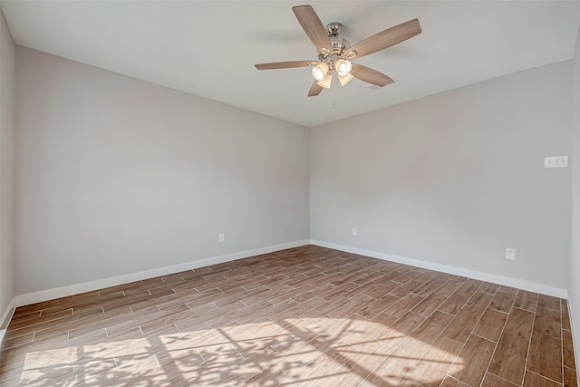 empty room with ceiling fan and light wood-type flooring