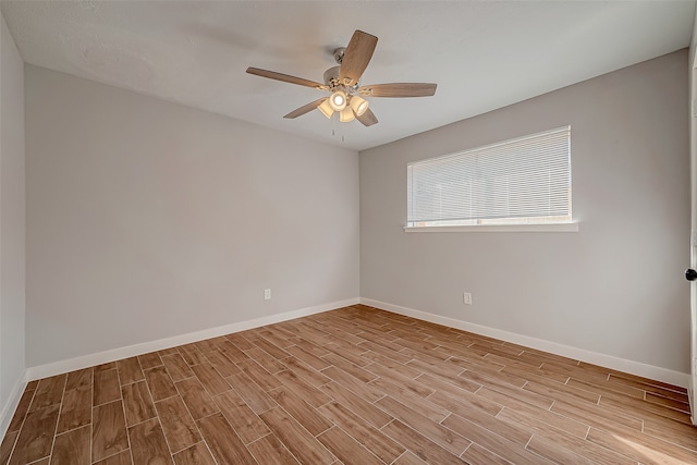 spare room featuring light hardwood / wood-style floors and ceiling fan