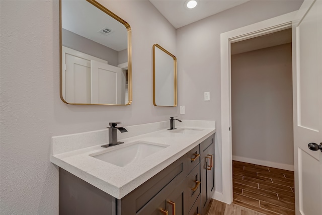 bathroom featuring vanity and hardwood / wood-style flooring