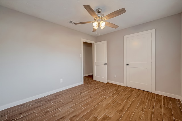 unfurnished bedroom with ceiling fan and light hardwood / wood-style floors