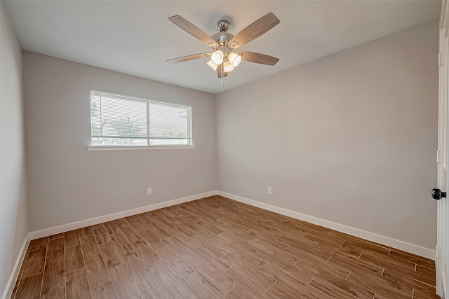 spare room featuring ceiling fan and light hardwood / wood-style flooring