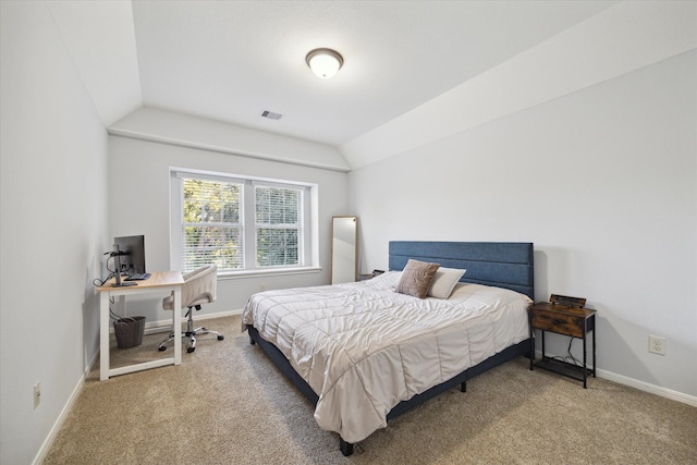 carpeted bedroom featuring vaulted ceiling