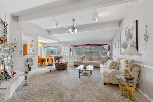 living area with lofted ceiling with beams, a ceiling fan, a textured ceiling, and carpet flooring