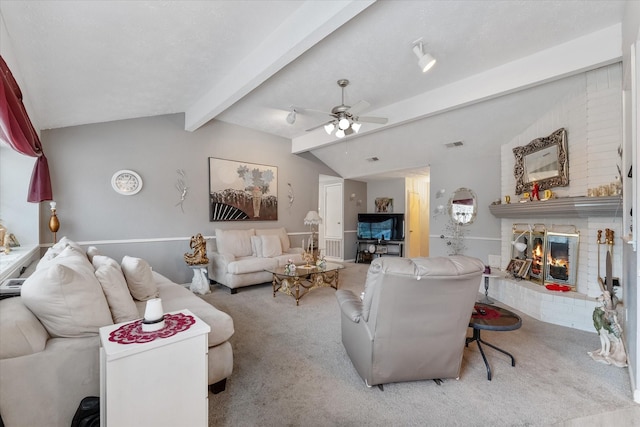 living area featuring visible vents, a brick fireplace, vaulted ceiling with beams, ceiling fan, and carpet floors