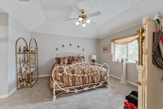 bedroom featuring a textured ceiling, lofted ceiling, baseboards, and carpet floors