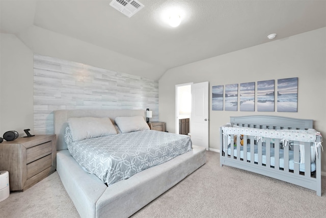 bedroom with lofted ceiling and carpet