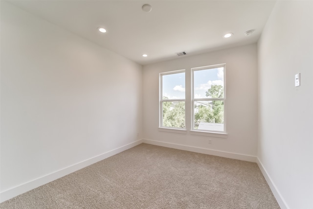 spare room with carpet floors