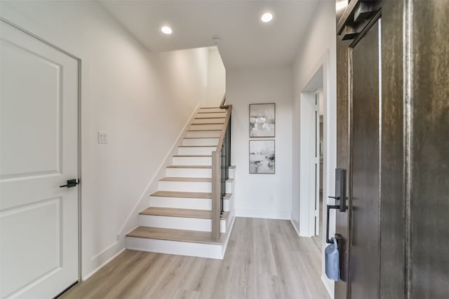 foyer with light wood-type flooring