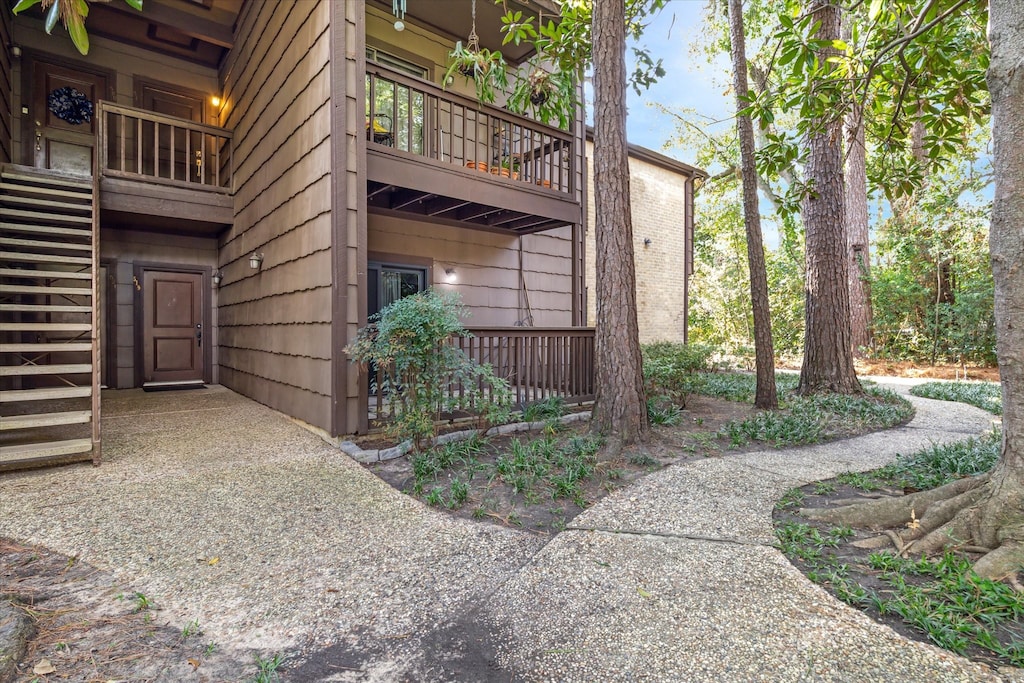 view of side of property featuring a balcony