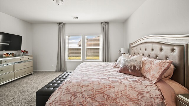 bedroom with light colored carpet