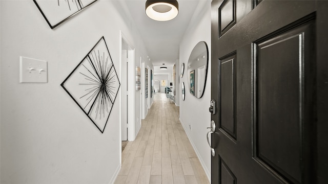 corridor featuring light hardwood / wood-style flooring