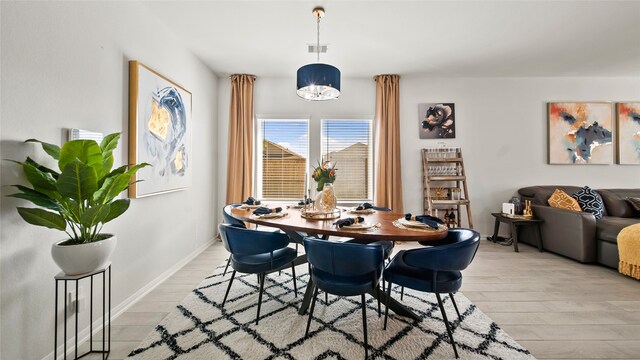 dining room featuring light hardwood / wood-style flooring