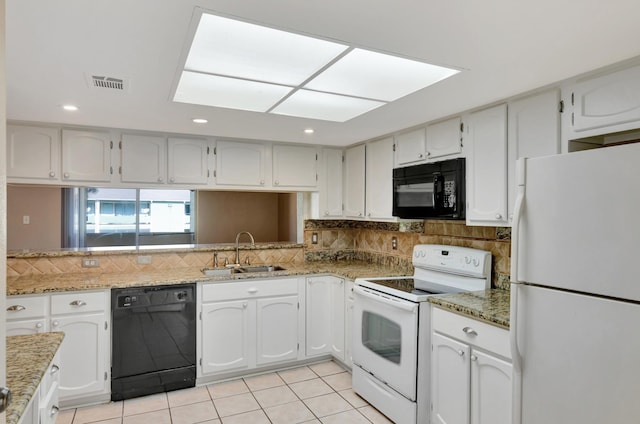 kitchen featuring white cabinetry, sink, decorative backsplash, light tile patterned floors, and black appliances