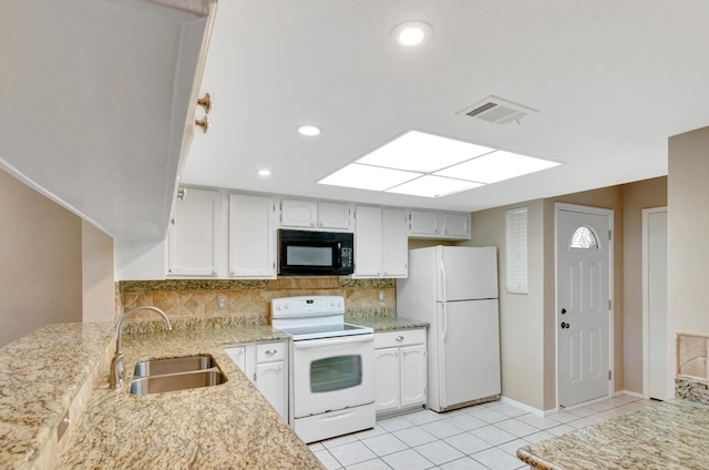 kitchen featuring decorative backsplash, sink, white cabinets, and white appliances