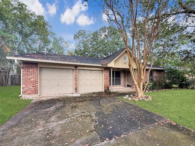 ranch-style home featuring a garage and a front lawn