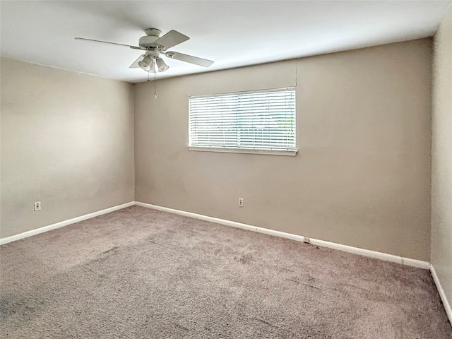 carpeted empty room with ceiling fan