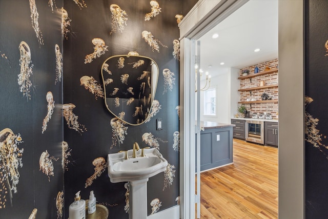 bathroom featuring hardwood / wood-style floors and wine cooler