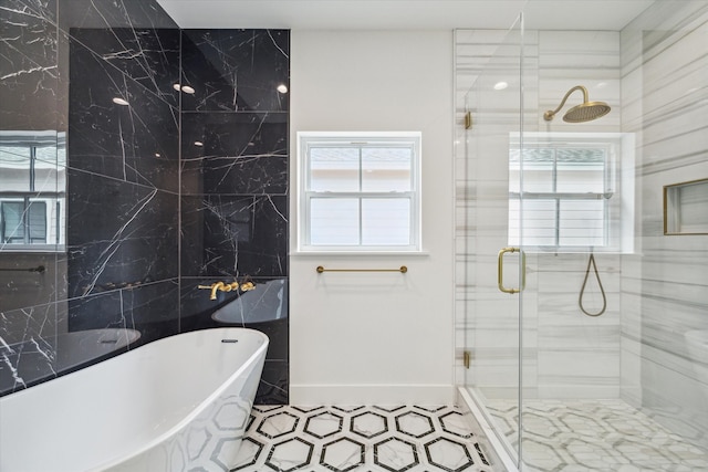 bathroom featuring tile walls and shower with separate bathtub