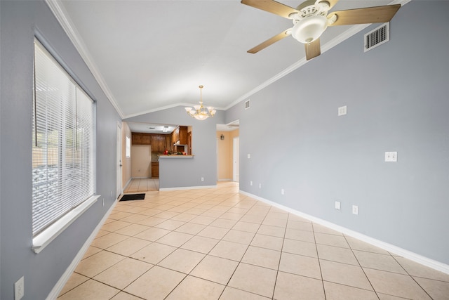 unfurnished living room featuring ceiling fan with notable chandelier, ornamental molding, light tile patterned floors, and vaulted ceiling