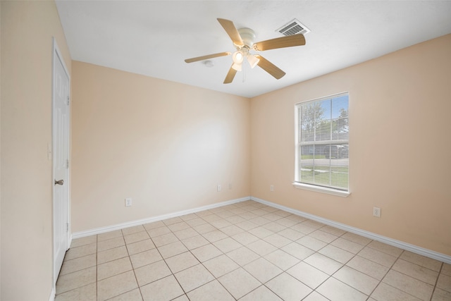 tiled empty room with ceiling fan