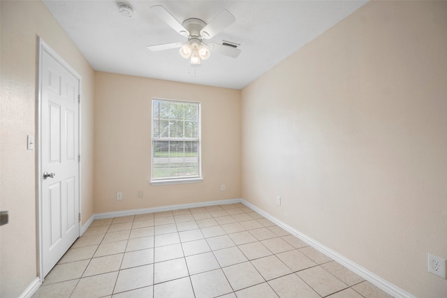 unfurnished room featuring ceiling fan and light tile patterned flooring