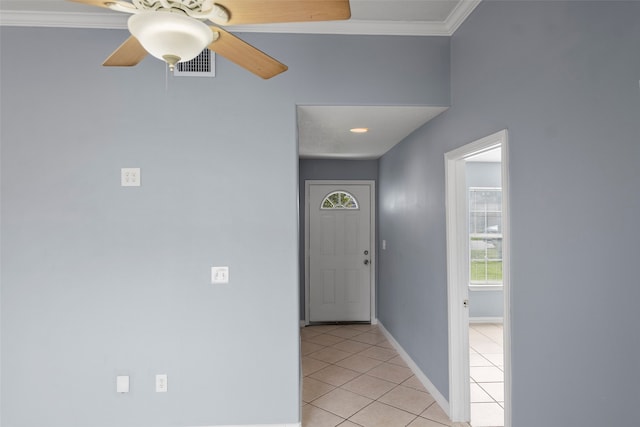 interior space featuring ceiling fan and ornamental molding